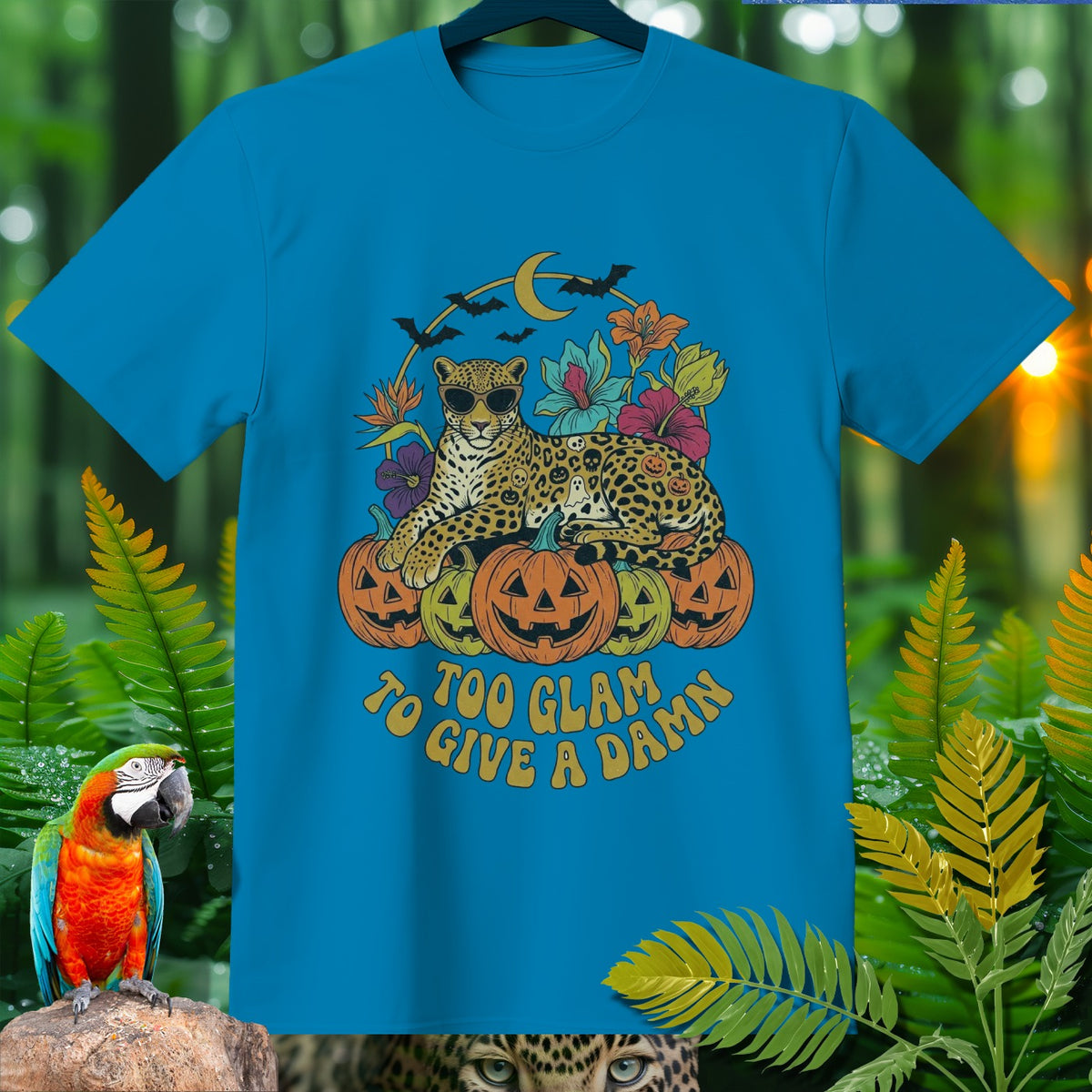 Turquoise t-shirt with a leopard on pumpkins graphic and text "Too glam to give a damn."