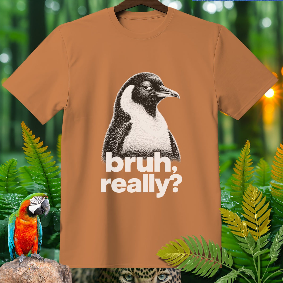 Orange t-shirt with a penguin graphic saying "bruh, really?"