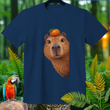 Navy t-shirt with a capybara's face and an orange on its head.