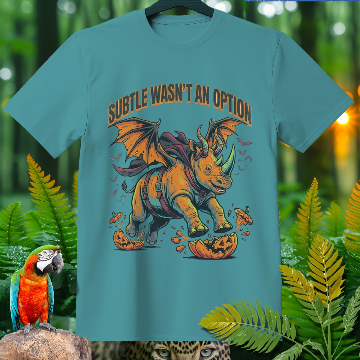Rhino with wings and bats, text "SUBTLE WASN'T AN OPTION," stomping on pumpkin.