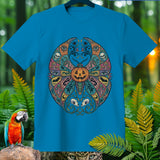 Blue t-shirt with a circular Halloween-themed mandala design featuring a jack-o'-lantern.