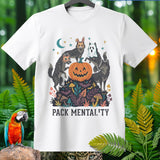White t-shirt with wolves in Halloween costumes around a jack-o'-lantern, text reads PACK MENTALITY.