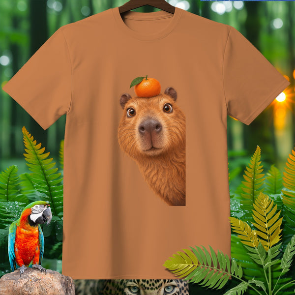 Capybara with an orange on its head on a brown t-shirt with jungle foliage.