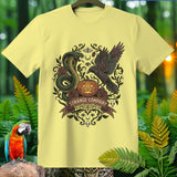 Light yellow t-shirt with a dark, occult-themed graphic featuring a snake, raven, and pumpkin.