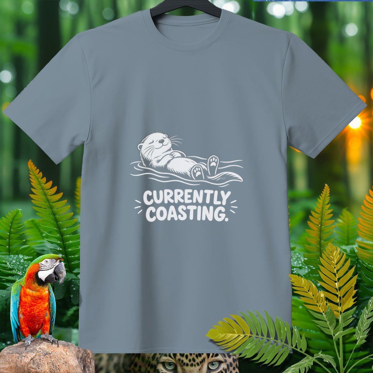 Gray t-shirt with white graphic of otter floating and text "CURRENTLY COASTING."