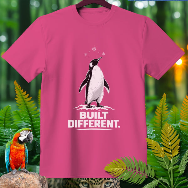 Pink t-shirt with a penguin illustration and text "BUILT DIFFERENT."