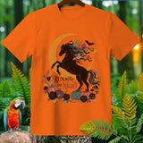 Orange t-shirt with a graphic of a rearing black horse, crescent moon, bats, and pumpkins.