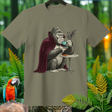 Gorilla in a cape drinks coffee with a bat at a tiny table.