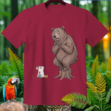 Bear on stump with nervous expression next to mouse in ghost costume with candy bag.