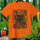 Orange t-shirt with black panther and floral graphic in jungle setting