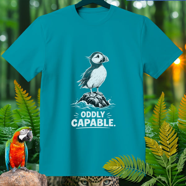 Teal t-shirt with a puffin on a rock and text "ODDLY CAPABLE."