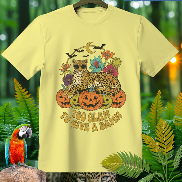 Light yellow t-shirt with a leopard and pumpkins Halloween graphic, text "Too Glam to Give a Damn".