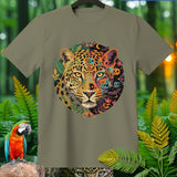 Leopard face with Halloween-themed designs and floral accents on a green t-shirt.