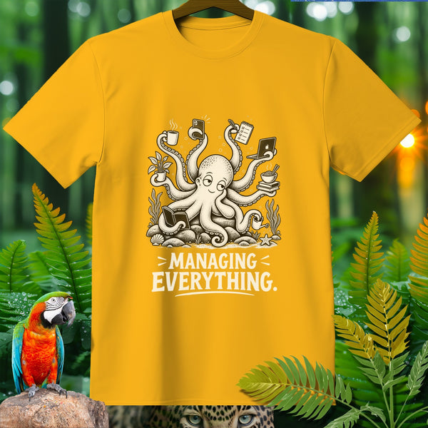 Yellow t-shirt with a cartoon octopus juggling coffee, phone, laptop, and books, text "MANAGING EVERYTHING."