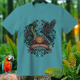 Teal t-shirt with Strange Company logo featuring snake, raven, pumpkin, and roses.