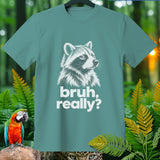 Teal t-shirt with raccoon graphic and text 