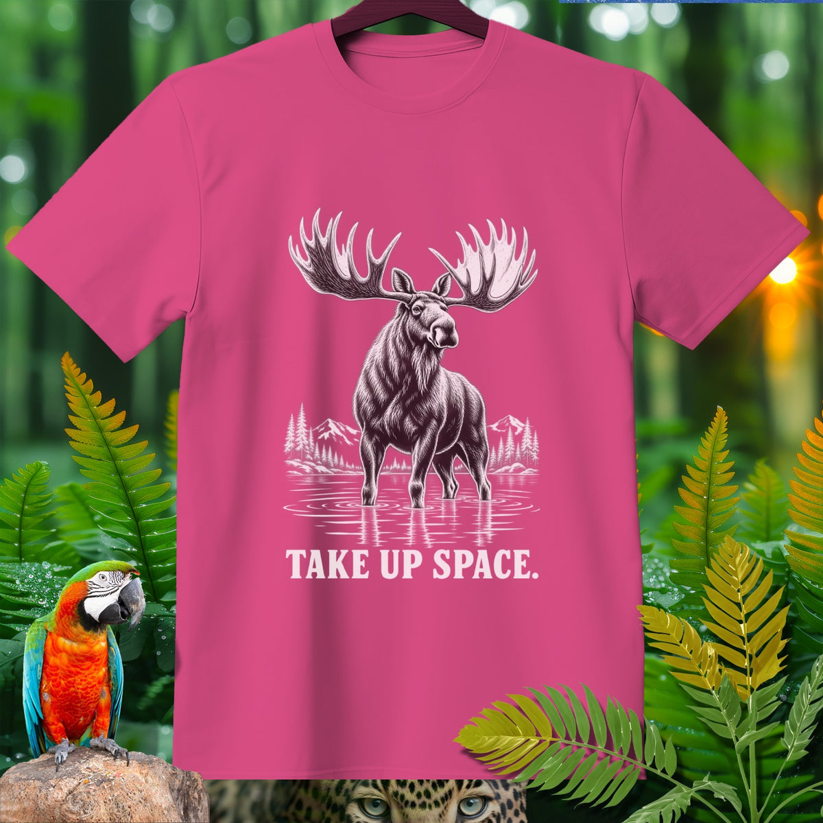 Pink t-shirt with moose graphic and "TAKE UP SPACE." text.