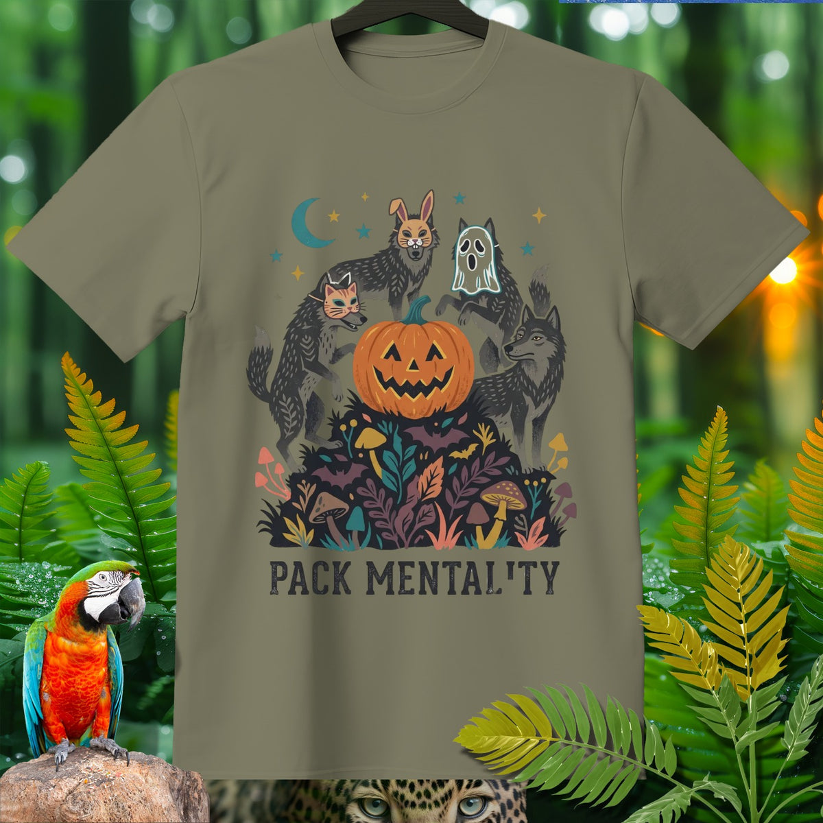 T-shirt graphic with wolves in costumes around a jack-o-lantern, reading "PACK MENTALITY".