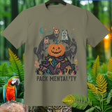 T-shirt graphic with wolves in costumes around a jack-o-lantern, reading 