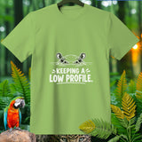 Light green t-shirt with a cartoon hippo peeking from water and text 