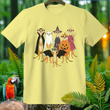 Light yellow t-shirt with a Halloween-themed graphic of meerkats in costumes.