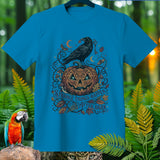 Blue t-shirt with Halloween design: crow, pumpkin, moon, and text 