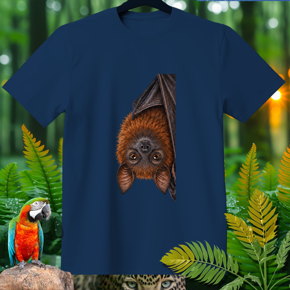 Dark blue t-shirt with hanging fruit bat illustration and tropical foliage.