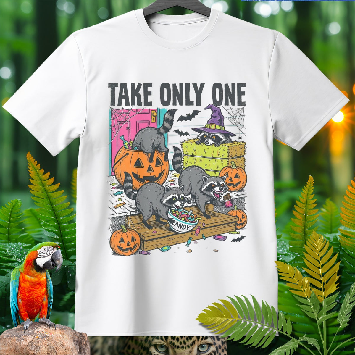 White t-shirt with "TAKE ONLY ONE" text and raccoons trick-or-treating for candy.