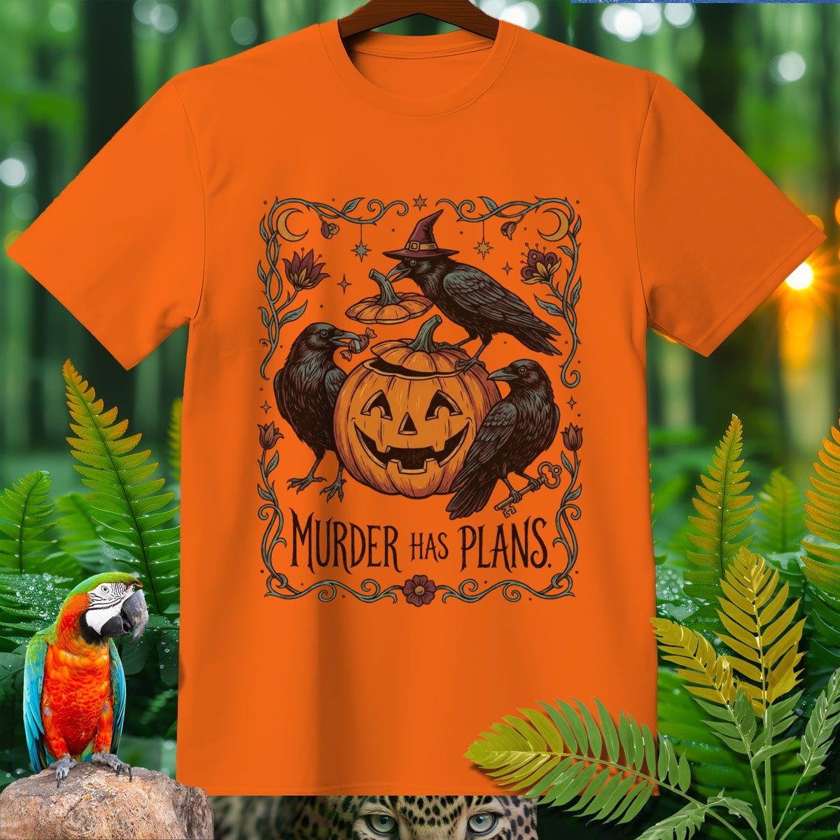 Orange Halloween t-shirt with crows, pumpkin, and the text "Murder Has Plans".