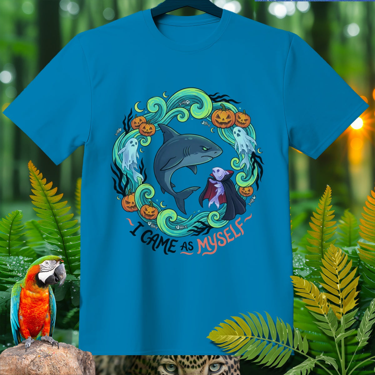 Teal t-shirt with shark, ghost, and pumpkins, says "I game as myself".