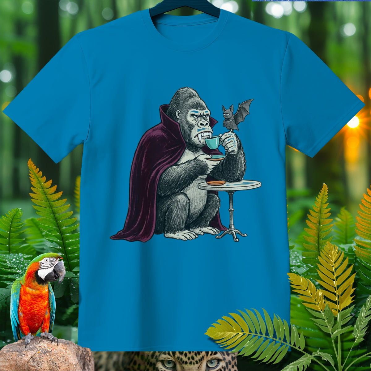 Gorilla in vampire cape drinks coffee with a bat at a table.