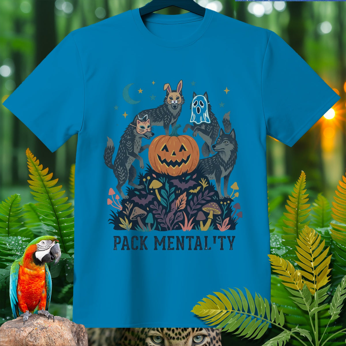 Blue t-shirt with wolves, jack-o'-lantern, and text "PACK MENTAL'TY".