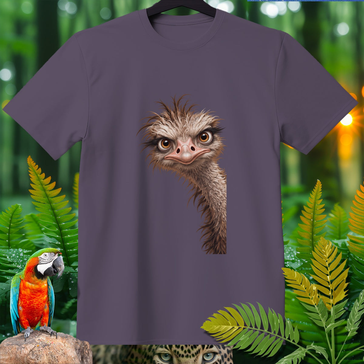 Purple t-shirt with cartoon ostrich face and tropical foliage design.