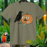 Raven and a pumpkin named Steve with glasses and a tie on a t-shirt.