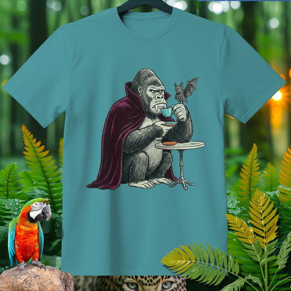 Gorilla in a cape drinking coffee with a bat on a teal t-shirt.