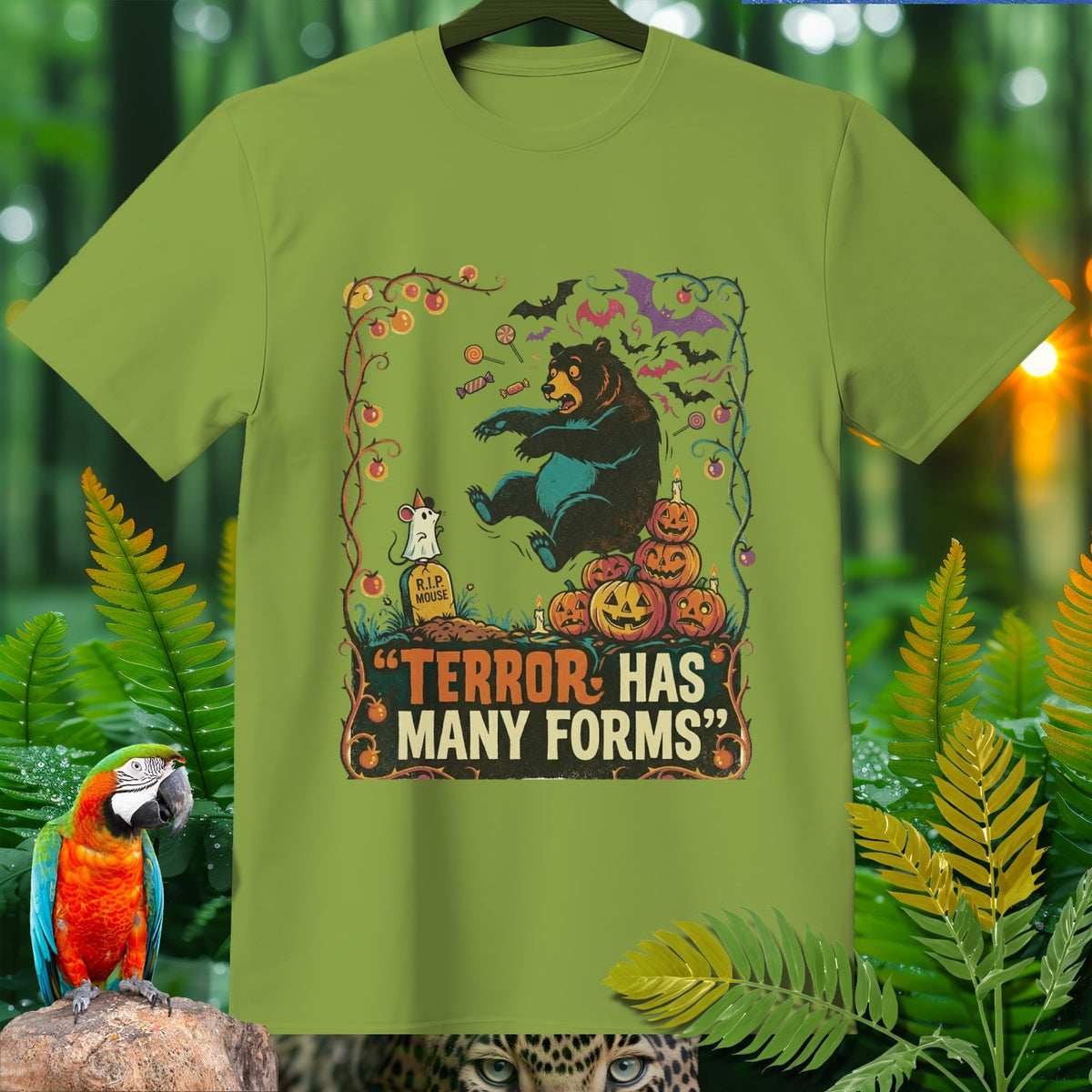Green t-shirt with Halloween graphic: bear, mouse, pumpkins, bats, and text "TERROR HAS MANY FORMS".