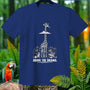 Blue t-shirt with graphic of giraffe above clouds with monkeys and zebra.