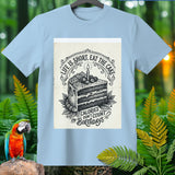 Light blue t-shirt with a black and white graphic of a slice of cake and text.