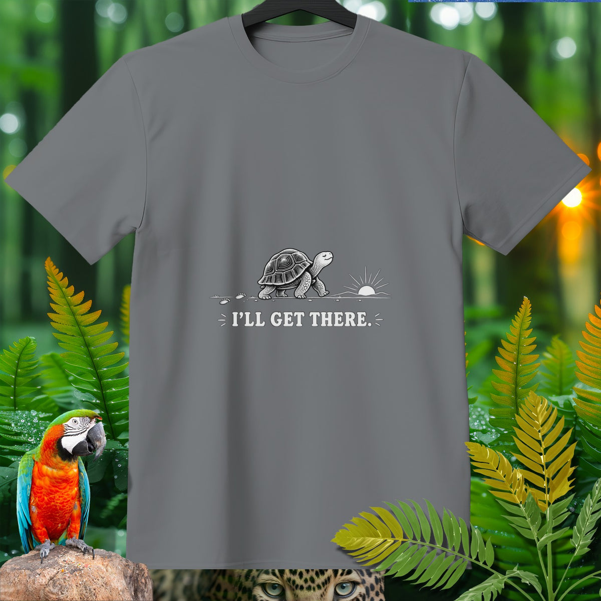 Gray t-shirt with a turtle walking towards a sunrise and the text "I'LL GET THERE."