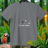 Gray t-shirt with a turtle walking towards a sunrise and the text 