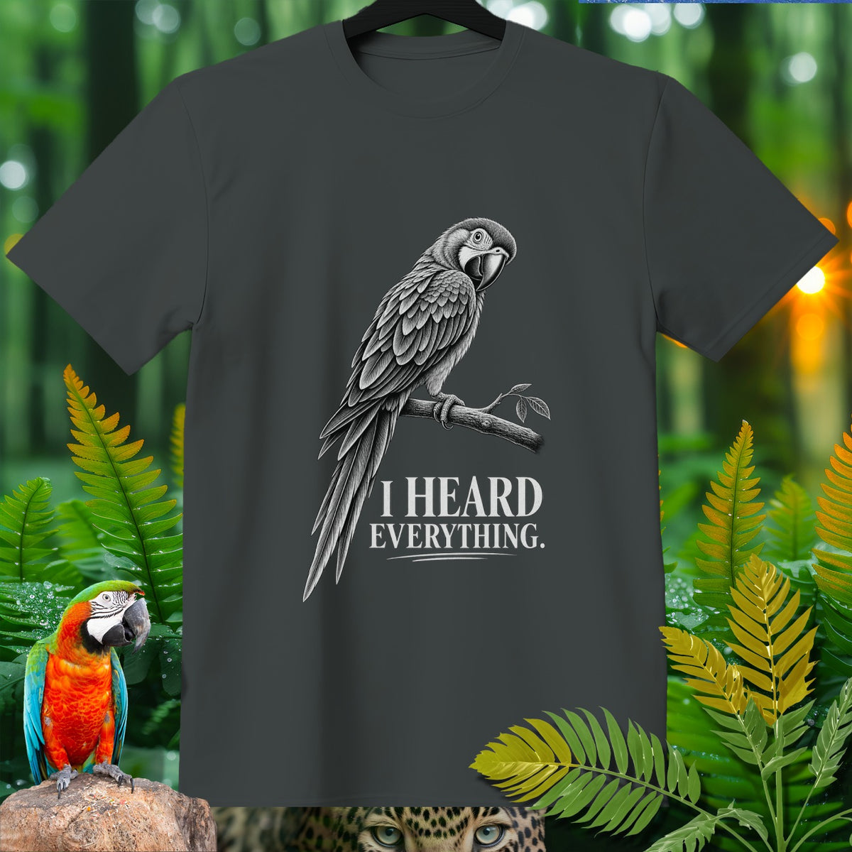 Dark grey t-shirt with a detailed parrot illustration and text "I HEARD EVERYTHING."