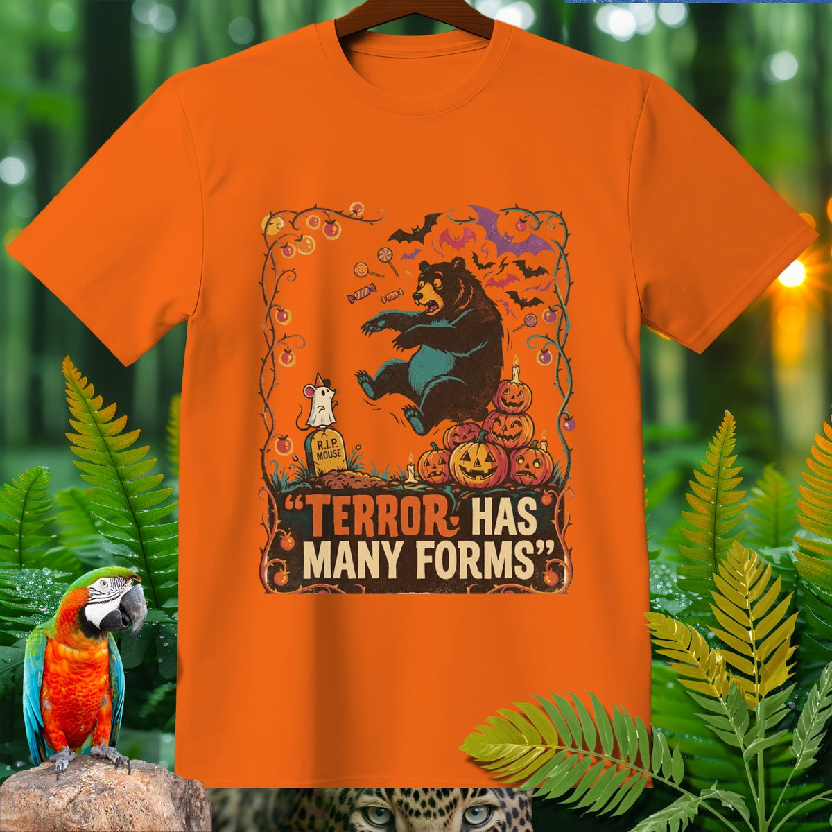 Orange t-shirt with Halloween graphic featuring a bear, mouse, pumpkins, and the text "Terror Has Many Forms".
